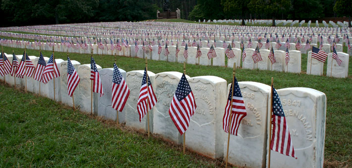 Photo of flags and headstones at Andersonville National Cemetery 
