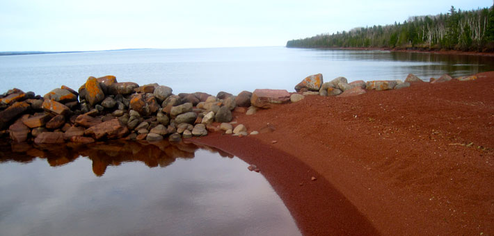 Photo of the red beach at Siskiwit Bay campground