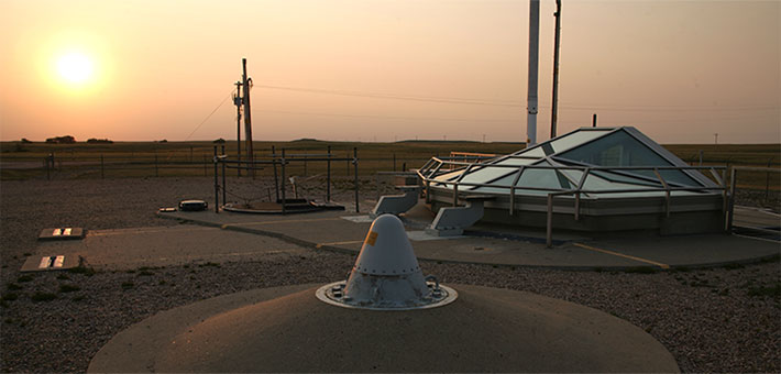The sun rises over a Minuteman II missile silo