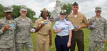 Photo of active duty military showing off their new passes
