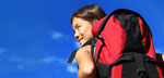 Photo of a young women, ready for a park adventure, with a big red backpack (Courtesy of Maridav/Bigstock.com)