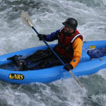 whitewater paddling along the rushing current 