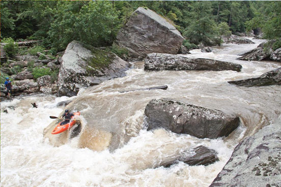 kayaker maneuvering a rapid on the Obed