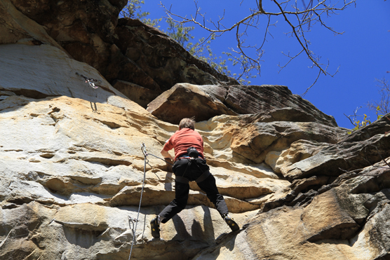 Climbing a rock face at the Obed.