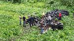 Crew assesses tire pile below Hurricane Ridge.