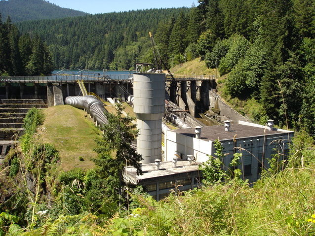 Elwha Dam, powerhouse and surge tower, with Lake Aldwell behind it.