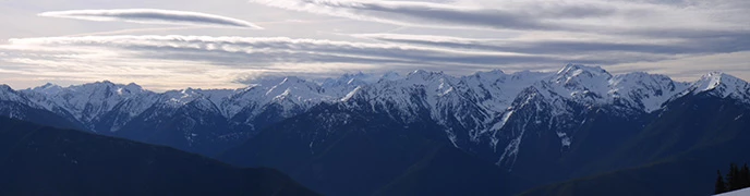 The snowy mountain peaks of the Bailey Range as viewed from Hurricane Ridge