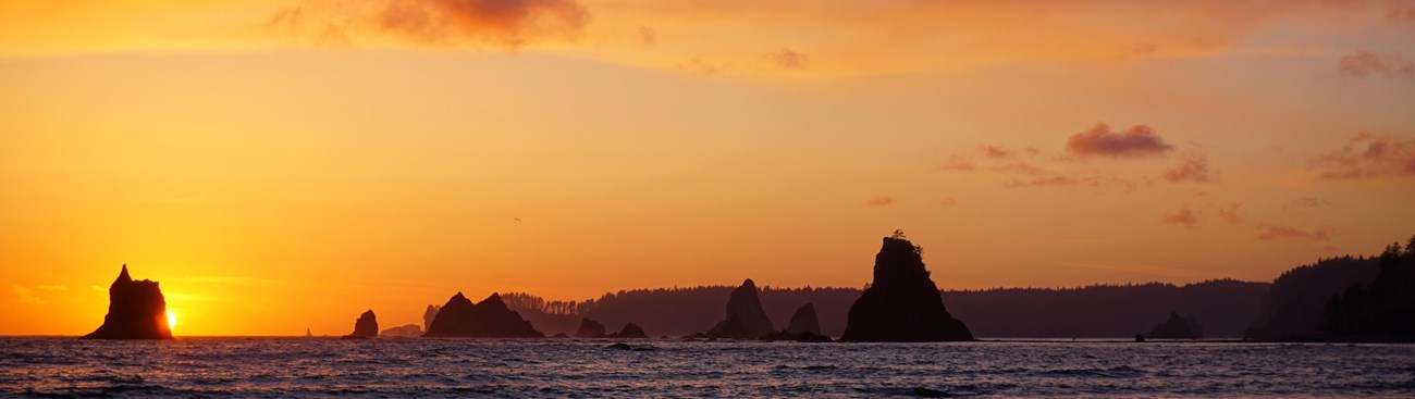 Sunset on the beach with sea stacks