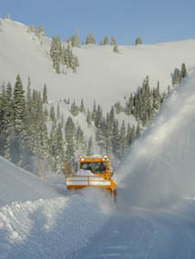 An Olympic National Park plow operator clears snow from Hurricane Ridge Road.