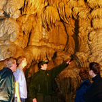A ranger shows cave formations at Paradise Lost.