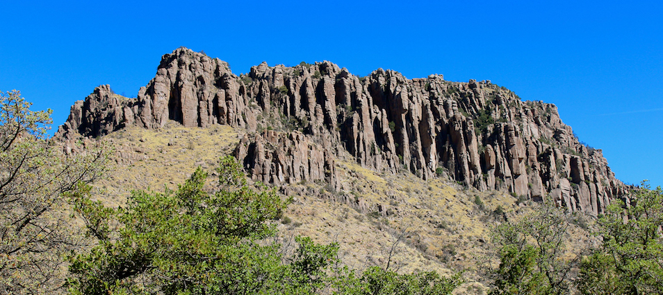 Rock pinnacles are the result of the erosion of compacted volcanic ash from the eruption of an ancient volcano just south of Chiricahua National Monument.