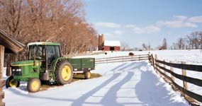 dairy barn and silo on snowy day