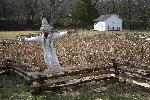 Schoolhouse and cornfield with scarecrow