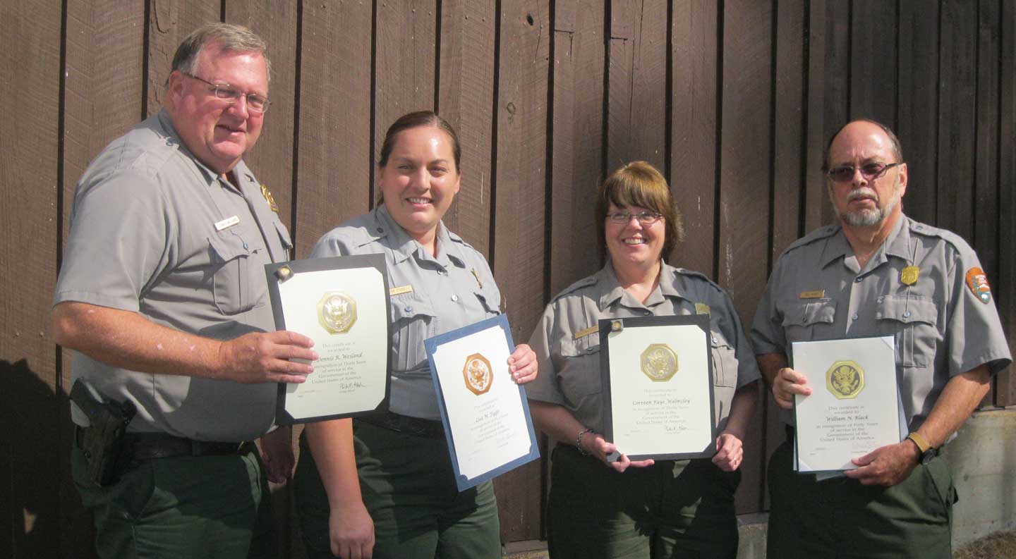 Park employees holding certificates