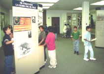 Students view exhibits about the battle