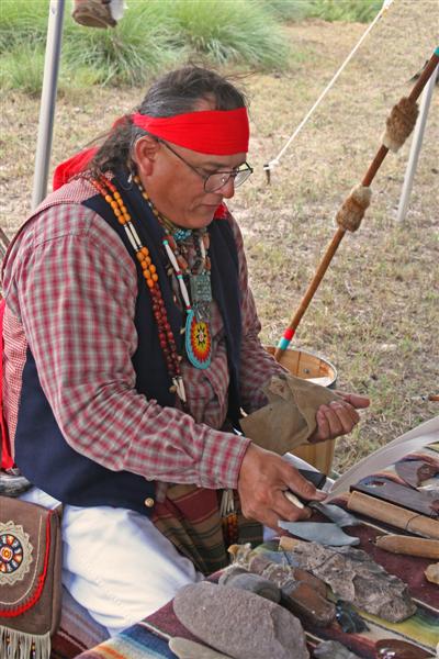 Presenter showing flint knapping skills