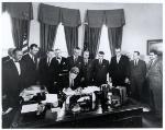 President Kennedy and staff in the Oval Office