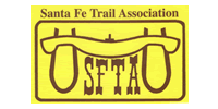 Santa Fe Trail Association logo, yellow with brown lettering, showing a yoke