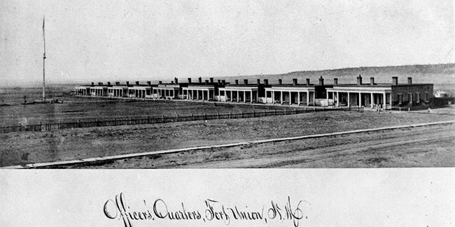 Vintage photo of barracks in distance