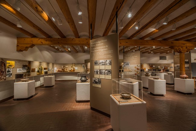 Pottery and artifacts on display in a museum setting.