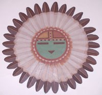 colorful Hopi sun face surrounded by feathers