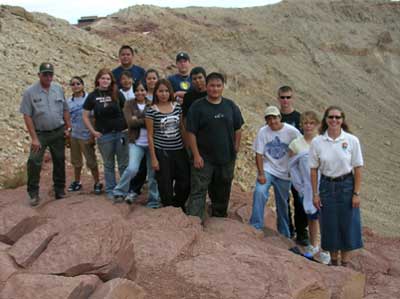 YCC crew and NPS employees standing on the edge of Meteor Crater