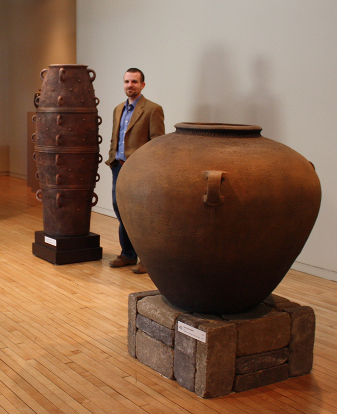 Brad with two of his large  ceramic pots