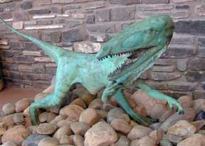 green dinosaur sculpture