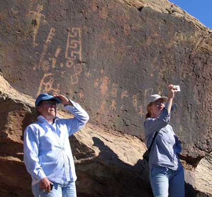 Giffords and Milstead study carved petroglyphs on sandstone rock surfaces