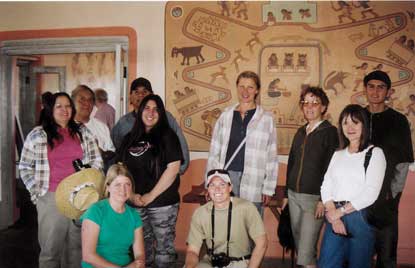 group of students in front of Fred Kabotie mural