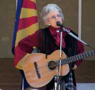 Buckshot Dot recites cowboy poetry in between songs and stories.