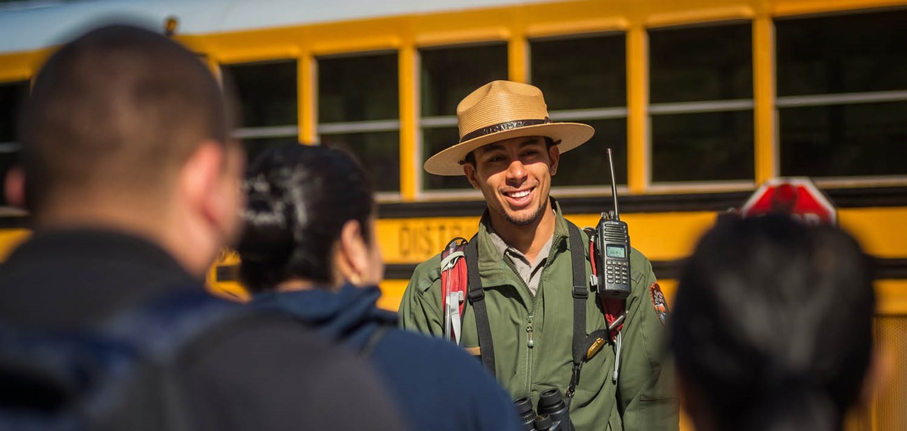 A ranger welcomes students and teachers to Pinnacles.