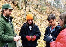Park Ranger and middle school students on a autumn field trip to Munising Falls.