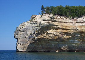 Indianhead Point stands proudly as a prominent feature along the Pictured Rocks cliffs.