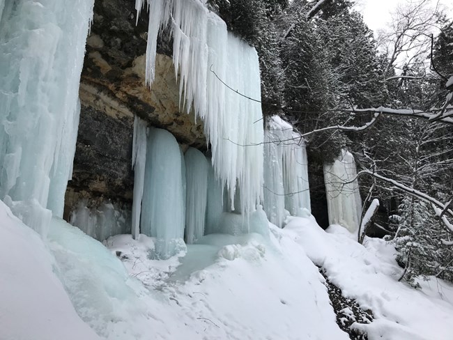 Ice curtains form on the cliffs at Sand Point