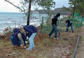 Students from Munising High School volunteer to maintain the trail along Miners Beach.