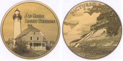 Bronze commemorative medallion features Bridalveil Falls and the Au Sable Light Station.