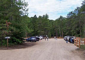Visitors mill about in the recently renovated Miners Beach parking area.