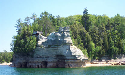 Miners Castle as viewed from Lake Superior.  Note the visitors on the viewing platform.