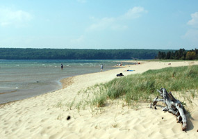 A hazy morning at Sand Point Beach as peaceful waves from Lake Superior wash ashore.