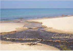Sullivans Creek flows into Lake Superior at a beautiful white sand beach.