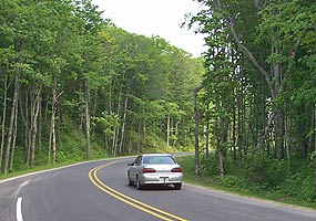 Visitor drives on a recently paved portion of Alger County Road H-58. Visitor drives on a recently paved portion of Alger County Road H-58.