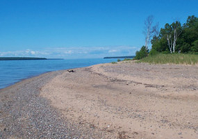 Sandy yet rocky beach along Ironwood Island at Apostle Islands National Lakeshore. Sandy yet rocky beach along Ironwood Island at Apostle Islands National Lakeshore.