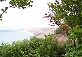 The Grand Sable Dunes tower over Lake Superior from this photo taken at the Log Slide. The Grand Sable Dunes tower over Lake Superior from this photo taken at the Log Slide.