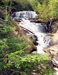 Sable Falls cascades down a sandstone shelves on its way to Lake Superior.