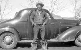 Wilson Mayo standing in front of car