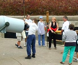 Docent leading loading demonstration of the gun