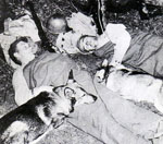 Soldiers resting with their dogs