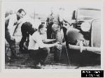 CCC Boys fixing tire