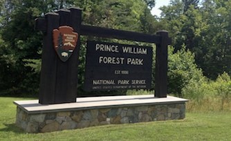 A wooden sign reading Prince William Forest Park. Established 1936. National Park Service.